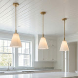 Connie Pendant 11, Rustic Brass and Opal Glass for Transitional home with White Siding