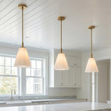 Connie Pendant 11, Rustic Brass and Opal Glass for Transitional home with White Siding