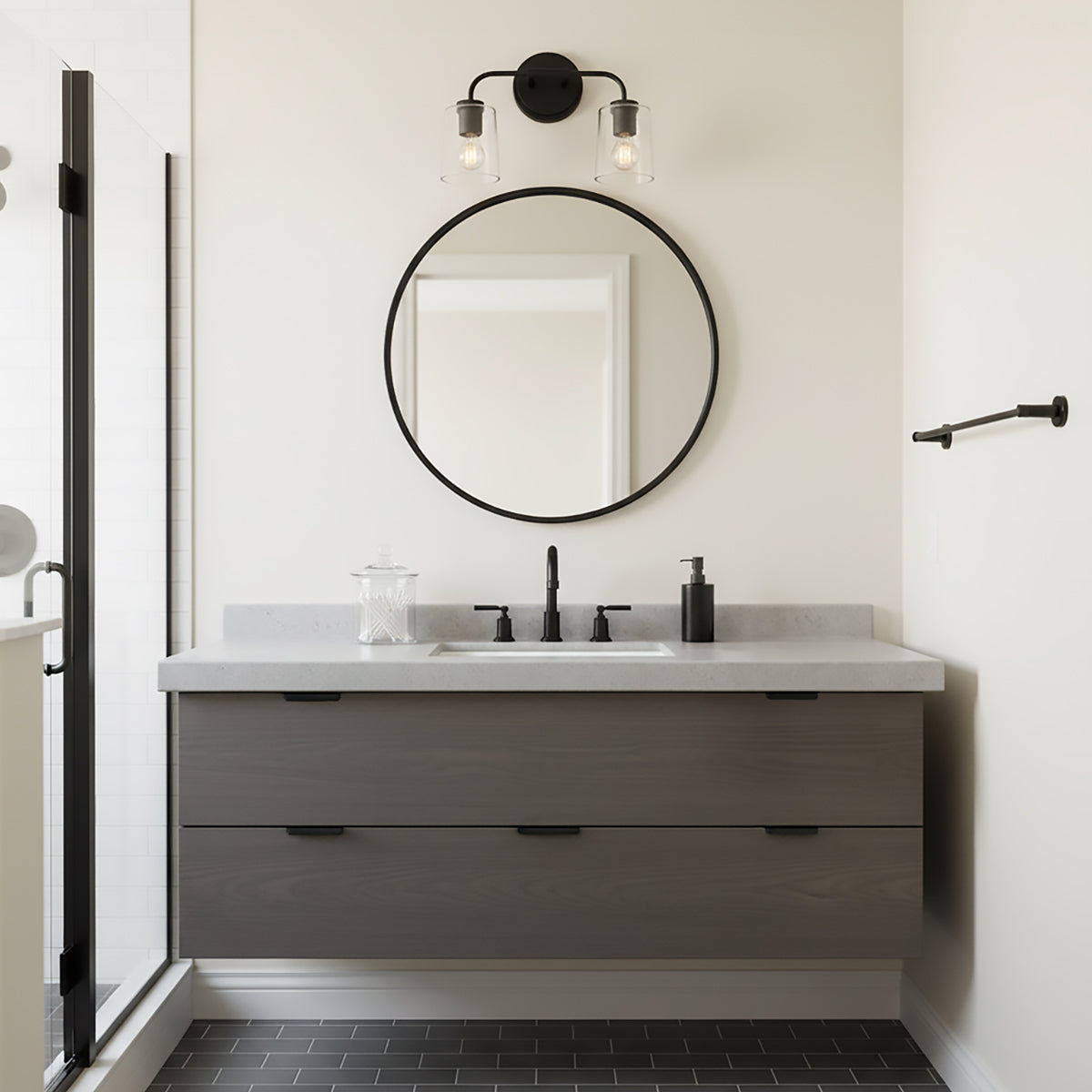 Wyatt 2 Light Vanity, Black with Clear Glass - Bathroom vanity with round mirror and matte black fixtures.