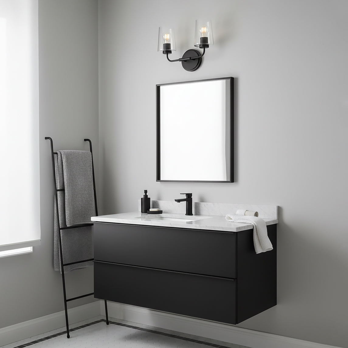 Wyatt 2 Light Vanity, Black with Clear Glass - Black vanity light with clear glass shades above a black framed mirror.