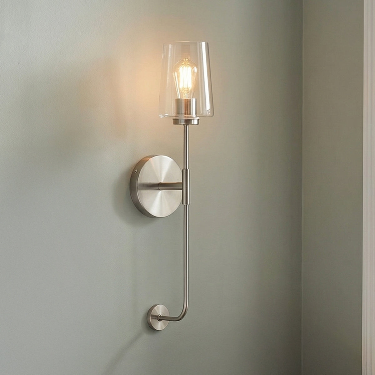 Brushed Nickel with Clear Glass linear wall sconce in a Modern Entryway.