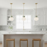 Piper Small Pendant 10, Satin Brass and Aquaverde - Three pendant lights hanging over kitchen island