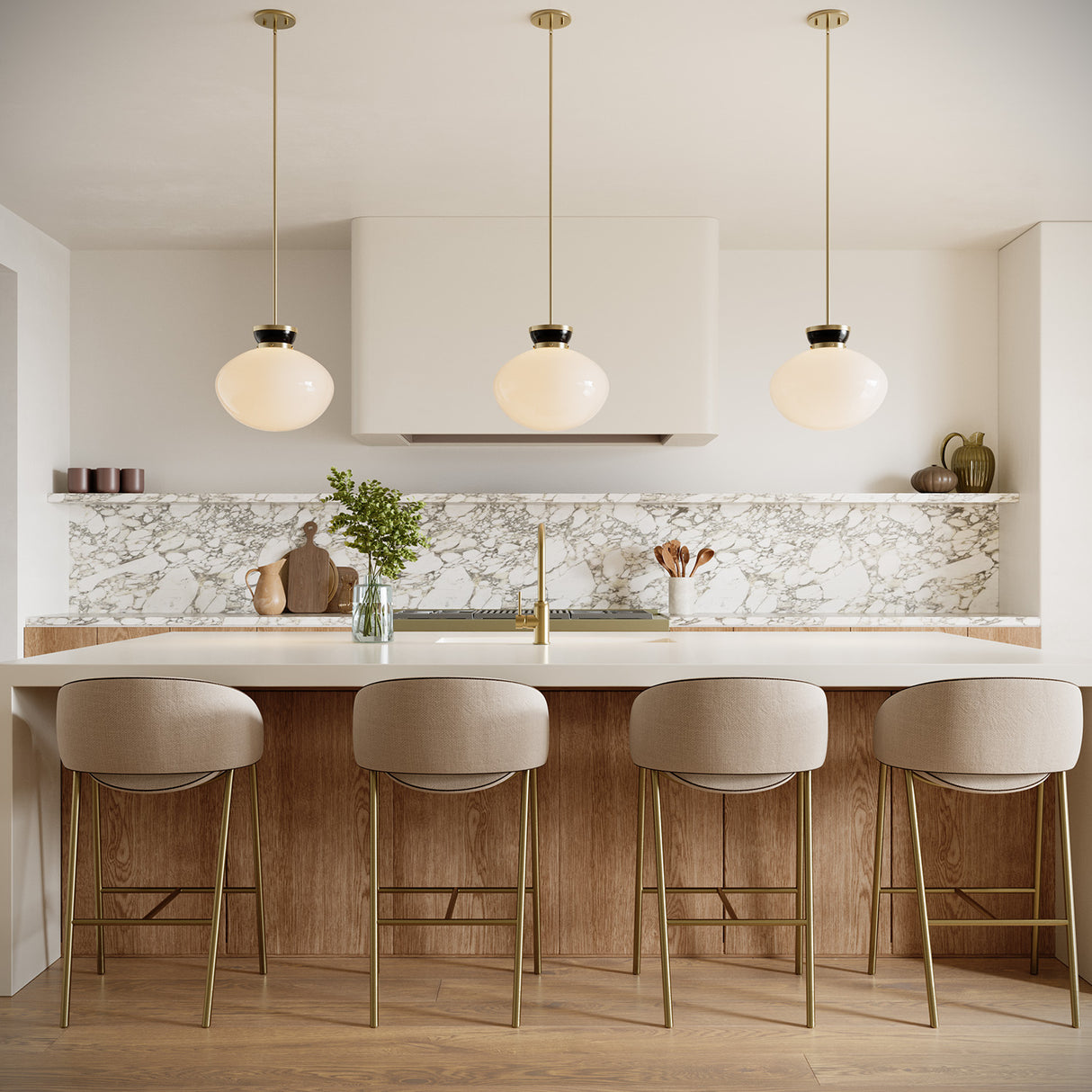 Three 15" wide Piper Pendant lights in Black with opal glass, hung above a large kitchen island in a modern home with marble backsplash and open shelving