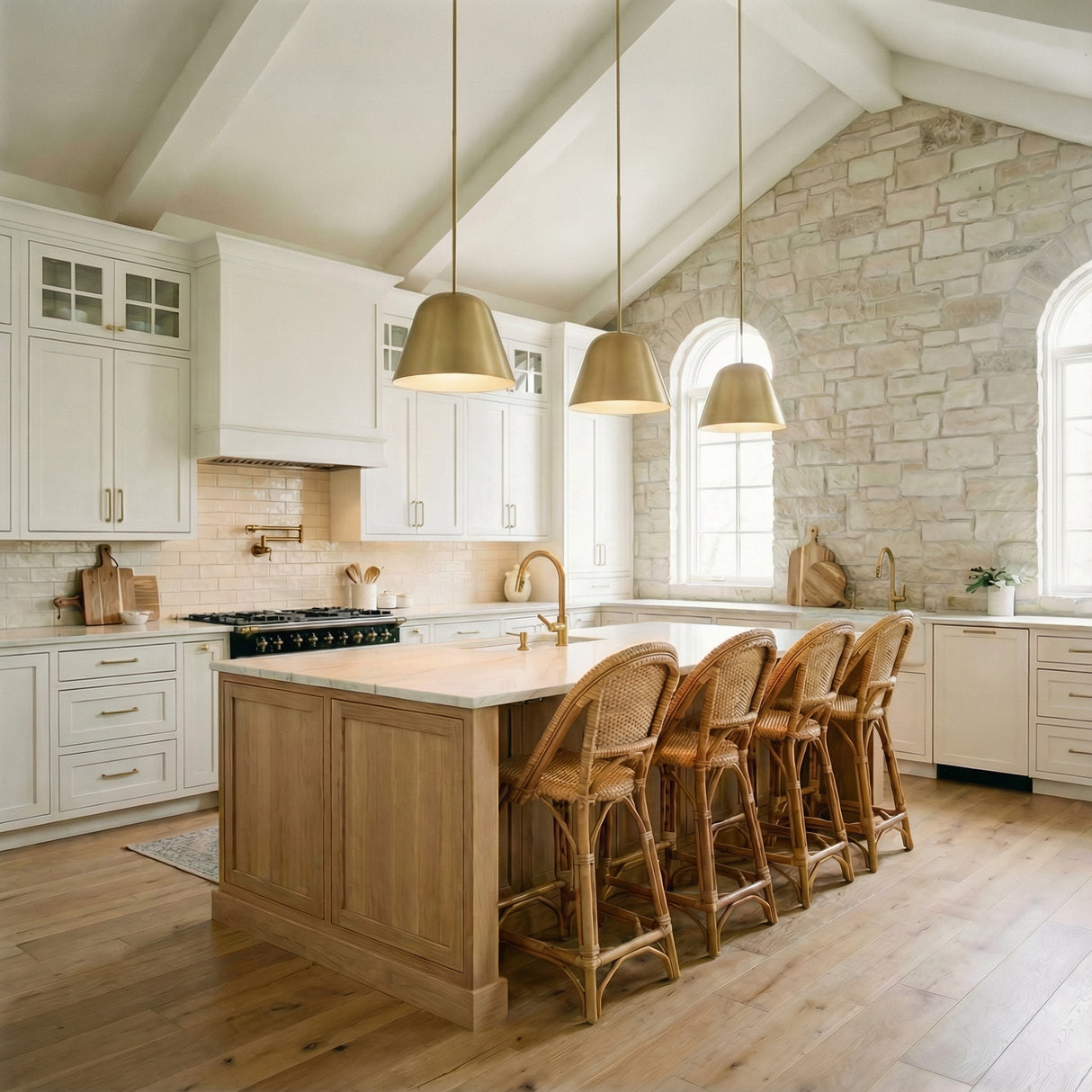 Ursa Pendant 16", Satin Brass geometric pendant in a Modern Farmhouse Kitchen with a white marble island and wicker bar stools.