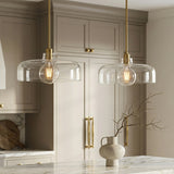 Alder Pendant 15", Satin Brass with Clear Glass for Modern Farmhouse home with Warm Beige Cabinetry