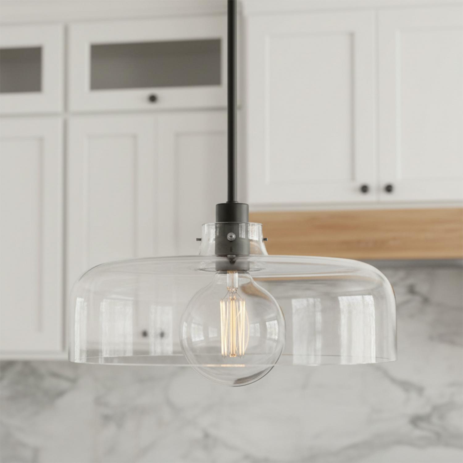 A transitional kitchen features a matte black Alder Pendant 15