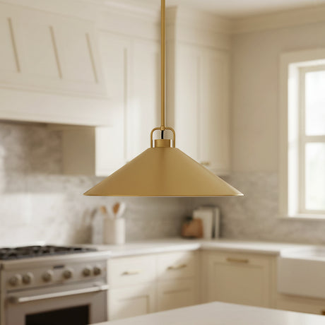 Modern kitchen with a brass Nyra metal pendant light fixture hung above the kitchen island