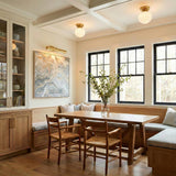 Irving Small Flush Mount 9", Satin Brass globe flush mount in a Transitional Dining Room with a rustic oak table and banquette.