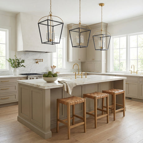 Langford Large Lantern Pendant 16", Black and Satin Brass geometric Pendant in a Transitional Kitchen with a white marble island and woven leather stools.