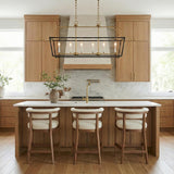 Langford Linear Lantern Pendant, Black and Satin Brass linear pendant in a Modern Farmhouse Kitchen with a white marble island.