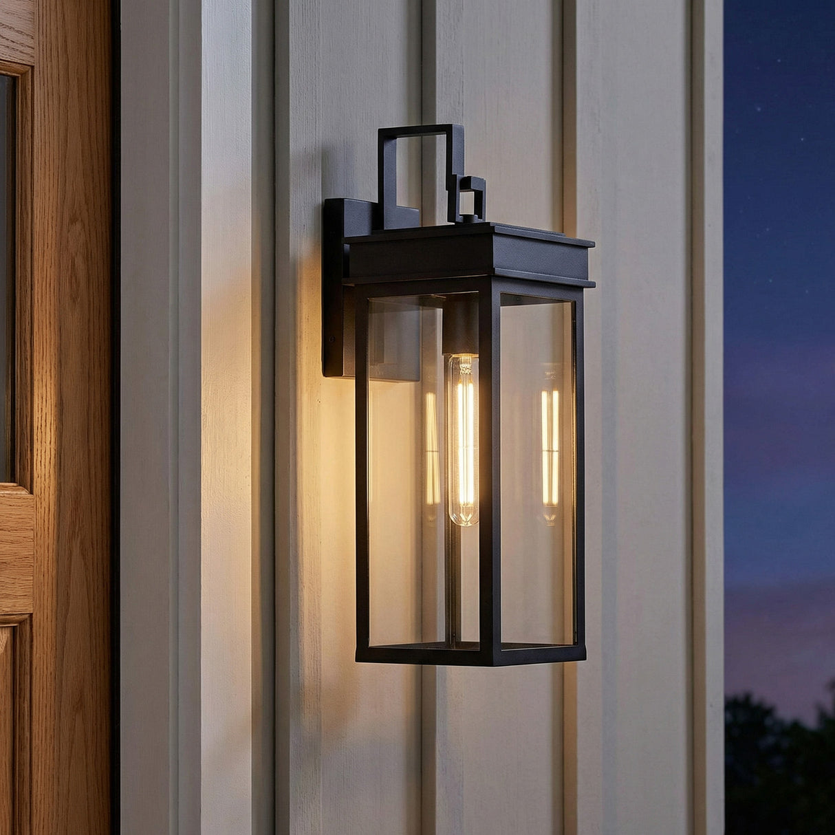 Monterey Outdoor Wall Light, Medium 18" Black geometric Outdoor Wall in a Modern Farmhouse Outdoor with white siding and wood door.
