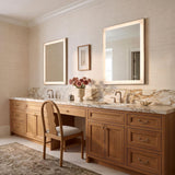 A transitional bathroom with two Demott Medium LED Rectangular 22" x 30", Brushed Nickel vanity mirrors mounted above a marble countertop and light oak double vanity.