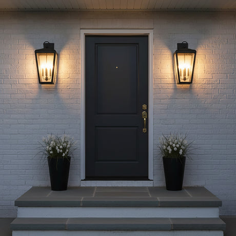 Barrett Outdoor Wall Light, Large 26" Textured Black - Two black lanterns flanking a dark gray door with white brick