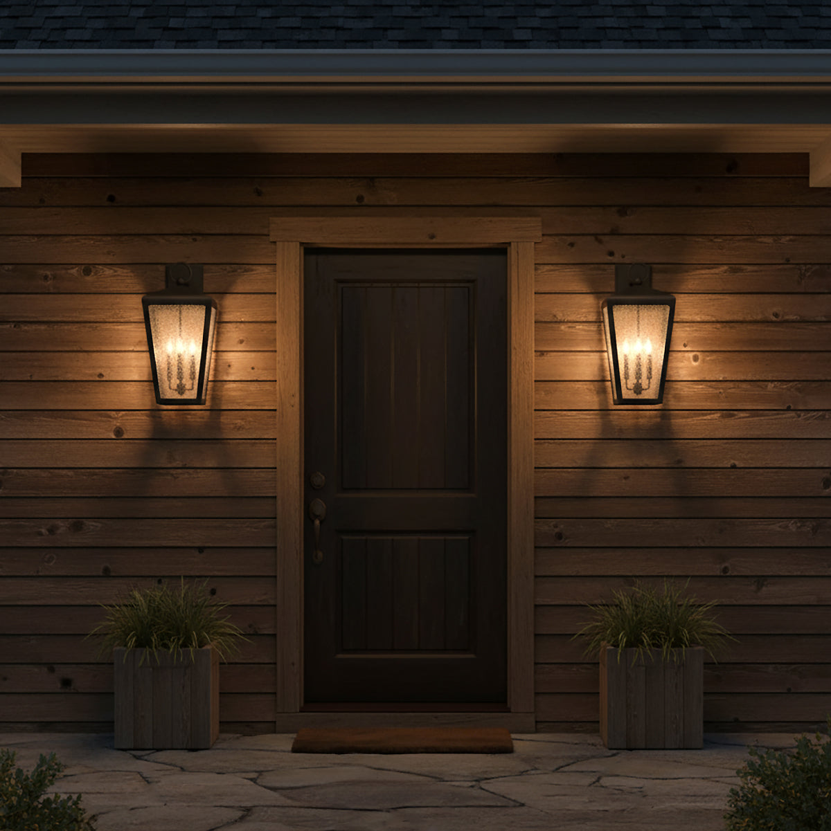 Barrett Outdoor Wall Light, Large 26" Textured Black - Two black lanterns flanking a dark wood door on a wood-paneled house
