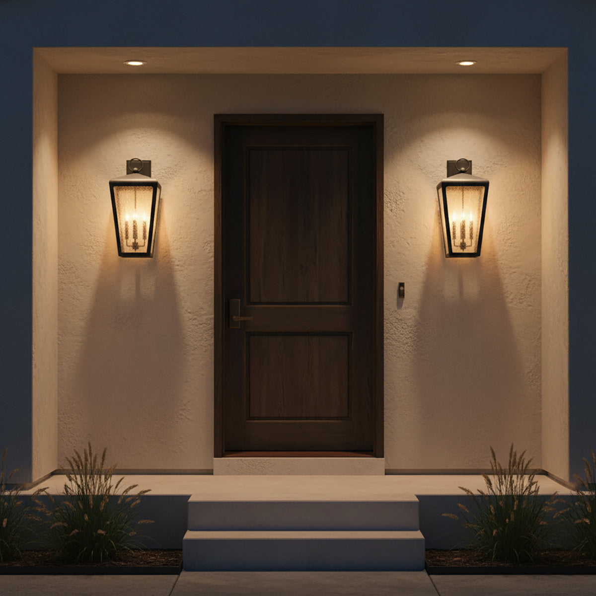 Barrett Outdoor Wall Light, Large 26" Textured Black - Two black outdoor wall lights illuminate a dark wooden door and the surrounding textured wall.