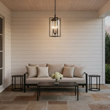 Peyton Outdoor Hanging Light 11", Textured Black - An outdoor hanging light above a patio seating area