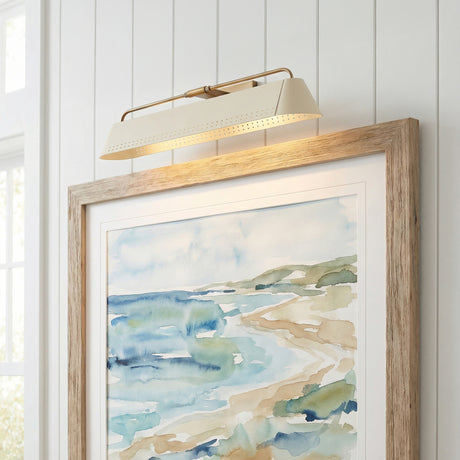 Henley Picture Light 25", Patina Brass and Soft Sand linear wall sconce in a Coastal Living Room with rustic oak framed art.