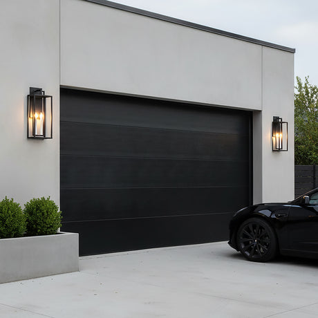 Durham Outdoor Wall Light, Large 25" Textured Black - Two black lantern-style lights flanking a black garage door.