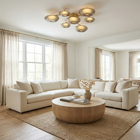 Gaia LED Flush Mount 41", Aged Brass geometric flush mount in a Transitional Living Room with a creamy sectional sofa and round wood coffee table.