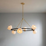 Penrose 6 Light Chandelier 43" styled in a Modern Living Room with grey walls.