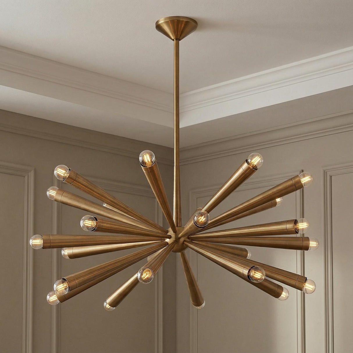 Camellia Large Chandelier 40", Patina Brass geometric Chandelier in a Mid-Century Living Room with wall paneling.