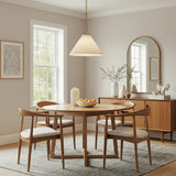 Charlotte Medium Pendant 22, Aged Brass styled in a Mid-Century Dining Room with wood furniture and neutral tones