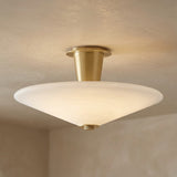 Imogen LED Flush Mount 19", Vintage Brass and Opal Glass geometric flush mount in a Modern Living Room with neutral textured walls.