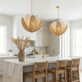 Natural Woven and Gold leaf design Chandelier in a Coastal Kitchen with a white marble island and woven bar stools.
