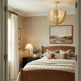 Gardenia Chandelier 36", Gold Leaf and Natural Beads woven leaf design chandelier in a Traditional Bedroom with a wood bed.