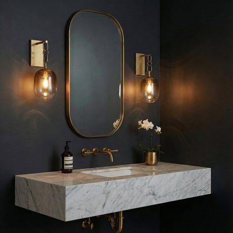 Blythe Wall Sconce 18", Patina Brass and Topaz Gradient Glass globe wall sconce in a Contemporary Bathroom with a marble vanity.