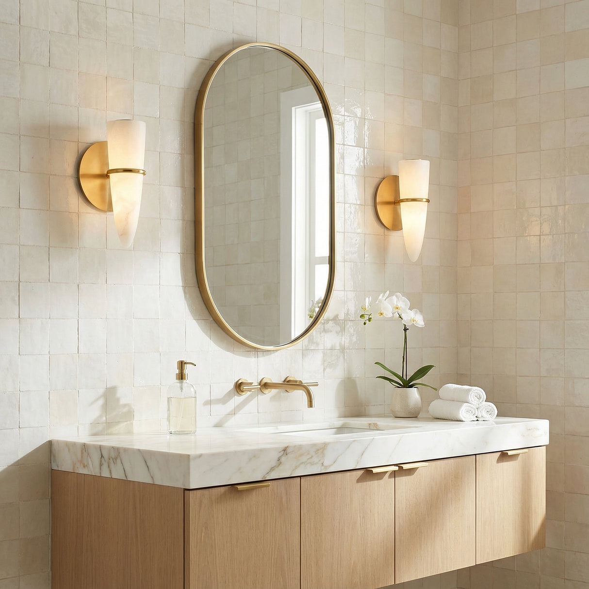 Vintage Brass and Alabaster linear Wall Sconce in a Transitional Bathroom with a white marble vanity and light wood cabinet.