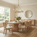 William 6 Light Ring Chandelier 36", Aged Brass geometric Chandelier in a Transitional Dining Room with cane chairs and an oak table.