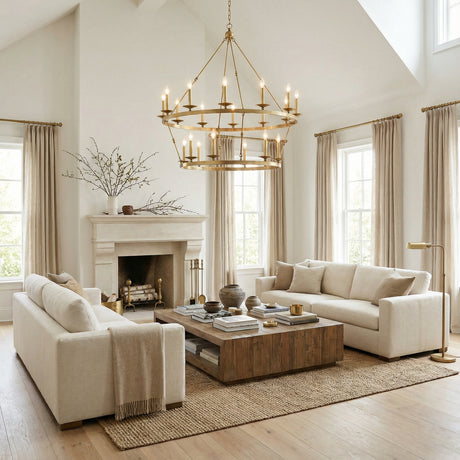 William Two-Tier Ring Chandelier 47", Aged Brass geometric Chandelier in a Transitional Living Room with neutral sofas and a reclaimed wood coffee table.