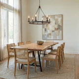 William 6 Light Ring Chandelier 36", Old Bronze geometric chandelier in a Transitional Dining Room with a live-edge table and cane chairs.
