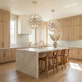 Genevieve Pendant 20", Natural Rope and Coco Shells White leaf design globe Pendant in a Coastal Kitchen with a white marble island.