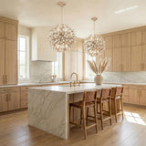 Genevieve Pendant 20", Natural Rope and Coco Shells White leaf design globe Pendant in a Coastal Kitchen with a white marble island.