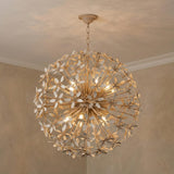 Genevieve Chandelier 30", Natural Rope and Coco Shells Cream globe chandelier in a Mediterranean Living Room with plaster walls.