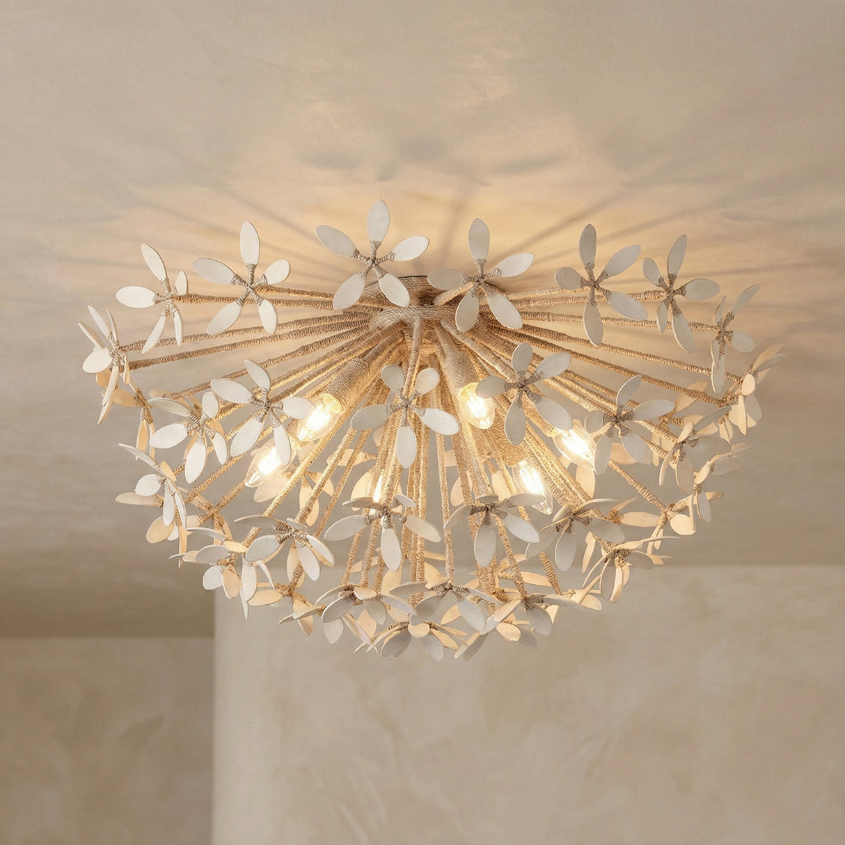 Genevieve Semi-Flush 30", Natural Rope and Coco Shells leaf design Semi-Flush in a Coastal Bedroom with textured plaster walls.