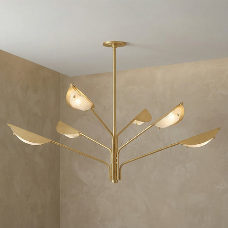 Gabrielle 6 Light Chandelier 54", Aged Brass with Art Glass leaf design Chandelier in a Modern Living Room with a textured plaster wall.