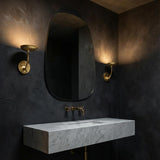 Reverie LED Wall Light 9", Gold Leaf leaf design Wall Sconce in a Contemporary Bathroom with a white marble vanity.