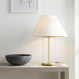 Elena Table Lamp, Brass and Clear Glass geometric Table Lamp in a Modern Living Room with a light wood console table and dark bowl.