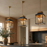 Harriet Lantern Pendant 13", Midnight Blue and Aged Brass geometric pendant in a Transitional Kitchen with a dark kitchen island and brass faucet.