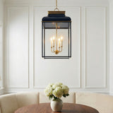 Harriet Lantern Pendant 19", Midnight Blue and Aged Brass geometric pendant in a Transitional Dining Room with a round wooden table and banquette.