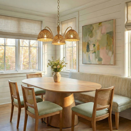 Karina 3 Light Chandelier 28", Woven Wicker and Aged Brass Aged Brass woven Chandelier in a Coastal Dining Room with an oak table.
