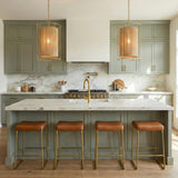 Valerie Pendant 20", Gold and Natural Rope woven pendant in a Modern Farmhouse Kitchen with a white marble island and leather bar stools.