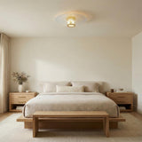 Verne LED Flush Mount 20", Aged Brass and Piastra Glass geometric flush mount in a Modern Bedroom with a light oak platform bed.