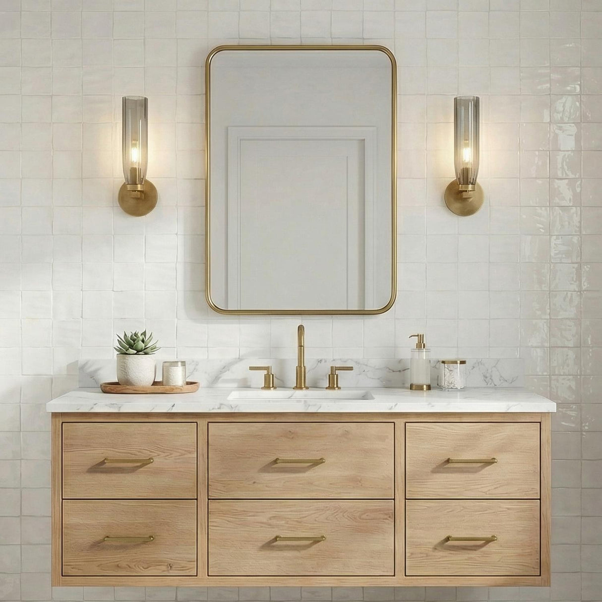 Ernest Wall Sconce 14", Aged Brass and Smoke Glass linear Wall Sconce in a Transitional Bathroom with a white marble vanity.