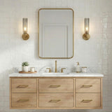 Ernest Wall Sconce 14", Aged Brass and Smoke Glass linear Wall Sconce in a Transitional Bathroom with a white marble vanity.