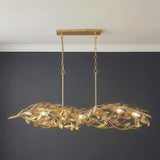 Artemis Linear Chandelier 48", Antique Gold leaf design Chandelier in a Transitional Dining Room with a dark charcoal wall.