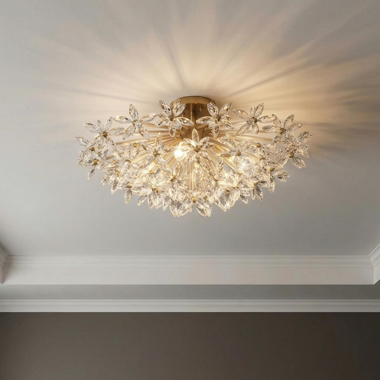 Eliana Semi-Flush 25", Aged Brass with Faceted Crystals leaf design Flush Mount in a Transitional Bedroom with white crown molding.